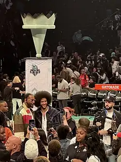 Colin Kaepernick poses with Carmelo Anthony after a New York Liberty/Las Vegas Aces WNBA Semifinals game, October 1, 2024