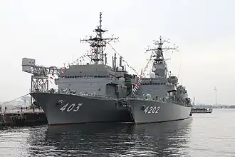 JS Kurobe alongside JS&nbsp;Chihaya at Yokosuka on 10 October 2015.