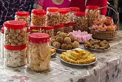 Image 74Aside from mandarin orange, various other snacks are presented for visitors throughout the Chinese New Year. (from Malaysian Chinese)