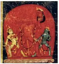 A decapitated, naked, red-complexioned woman stands, raising her left arm which holds her severed head. She is flanked by two smaller women, also naked: a white-coloured one (left) and a blue-coloured one (right).