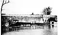 The captain jumped off the boat before the wall went out, dumping the boat into the creek below. There were no casualties in this accident.