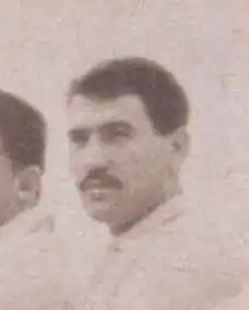 This person. Man with mustache.