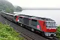 A Cassiopeia cruise train hauled by JR Freight Class DF200 diesel locomotive DF200-61 in Hokkaido in July 2016