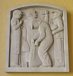 sculpture on east side of main entrance. Signed: David Slivka, 1937