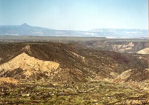 Dixon, New Mexico. View looking west. Cerro Pedernal is the flat peak on the horizon left.