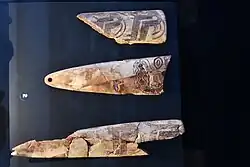 Incised bone pendant fragments