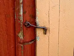 A cabin hook used as a latch for a wooden gate