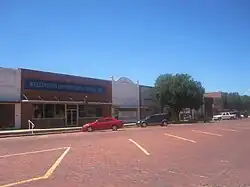 Downtown Wellington across from the Collingsworth County Courthouse; the Collingsworth County Historical Museum and Art Center is located behind the tree.
