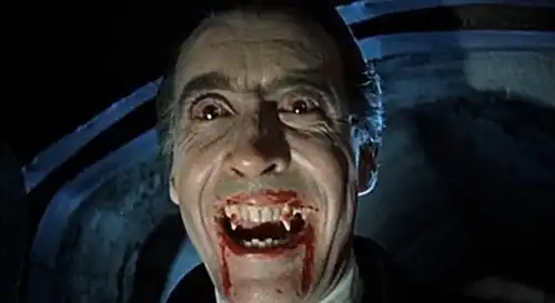 Film still of Christopher Lee wearing red contact lenses