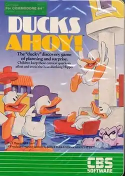 Cover artwork depicting cartoon ducks at a city canal. One duck jumps into a red boat that has a duck sitting in it while two other ducks are across the canal. A purple hippopotamus sticks its head out of the water looking up at the jumping duck.