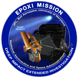 A circle with a blue border encloses an image of a spacecraft on approach to a comet. The words "EPOXI Mission" and "Deep Impact Extended Investigation" are written along the border of the image.