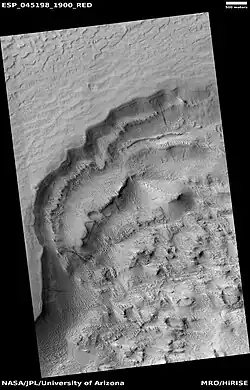 Wide view of scarp showing layers, as seen by HiRISE under HiWish program