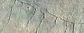 Close, color view of lines of pits, as seen by HiRISE under HiWish program