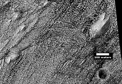Layers, crater, and mounds on floor of Danielson, as seen by HiRISE