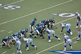 Donovan McNabb (#5) calls plays to Matt Schobel (#89).