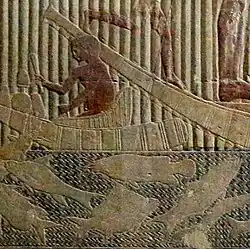 Electric catfish (center) in bas-relief[5]