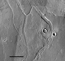 Middle portion of Enipeus Vallis. The valley divides into several channels, forming large central island at 37.0°N, 267.2°E. Image is THEMIS VIS mosaic.