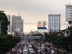 The boulevard with heavy afternoon rush hour traffic