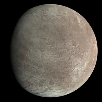 Surface predominantly white, with a prominent brown oval on the lower right named Callanish crater