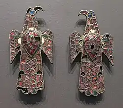 The Eagle-shaped fibulae of Alovera; 5th century; gold, bronze and glass (imitation of garnet); height: 11.8 centimetres (4.6&nbsp;in), width: 5.9 centimetres (2.3&nbsp;in); from Guadalajara (Spain); National Archaeological Museum (Madrid, Spain)