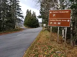 Road sign indicating Fabbri Memorial and Fabbri Picnic Area are ahead on opposite sides of the road.