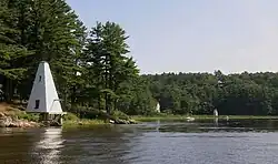 The fog signal (left) was tended by the keepers of the Doubling Point Range Lights a short distance downriver. The keeper's house is in the center and the front range light is to the right.