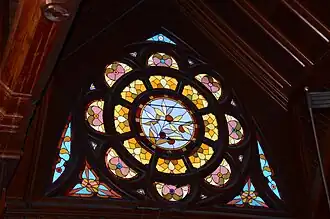 One of the four dormer windows in the roof of the main auditorium