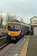 A First TransPennine Class 185 passes the signal box.