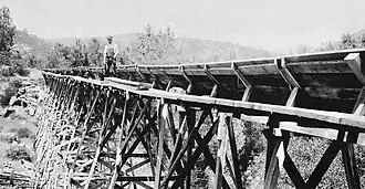 Narrow catwalks provide maintenance access along the length of the flume.