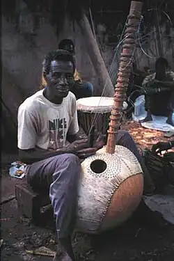 Image 12Master Kora maker Alieu Suso in the Gambia (from Origins of the blues)