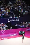 Performing under a high throw of the hoop (Hanna Rizatdinova)