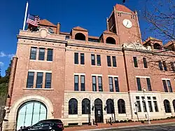 Renovations had replaced the garage's westernmost M Street door with architectural glazing by December 2018.