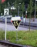 An Lf7 "Speed limit 20km/h", a handmade Zs3v "Expect speed limit 15km/h", and an H/V main signal showing Hp0 "Stop"