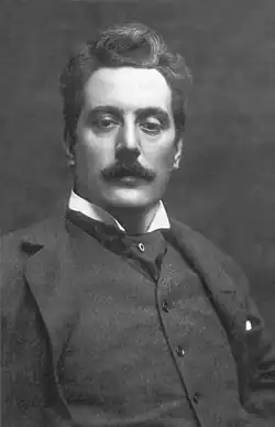 Black-and-white photograph of a young, moustachioed man.
