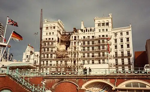 The Grand Hotel with a large hole in the front, caused by the explosion
