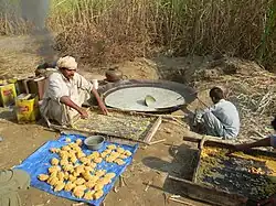 Jaggery (gur) making at small scale near sugarcane farm in Pakistan