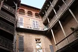 Astorg: timber galleries in the court.