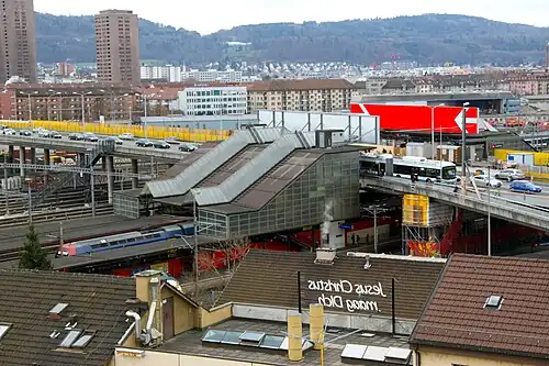 Railway station under the bridge, and tram/bus stop on the bridge