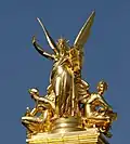 C. L'Harmonie (1869) by Charles Guméry is a 7.5-metre (25&nbsp;ft) tall sculpture that crowns the Palais Garnier (the Opera) in Paris, France. The statue is a gilded copper electrotype, sometimes called a galvanoplastic bronze.[28]