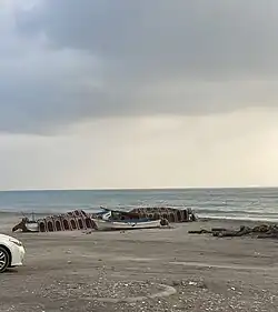 A view of the village’s beach with fishing boats.