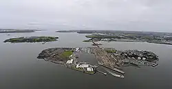 Aerial view with Naval Base to west (right), former industrial site to east (left) & dockyard (centre)