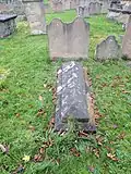 Headstone and chest tomb 10 metres south of chancel