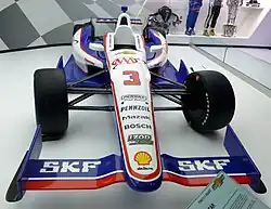 Helio Castroneves' DW12 chassis on display