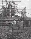 A Kannushi performs a shrine Tamagushi ceremony during the construction of the shamusho (社務所) of the Hirohara shrine (c. 1944)[5]
