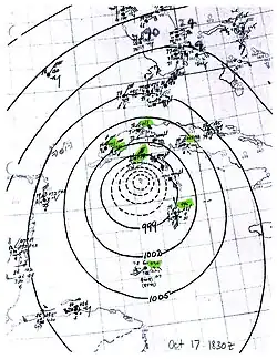 A map showing the cyclone's isobars with nearby weather station observations plotted.