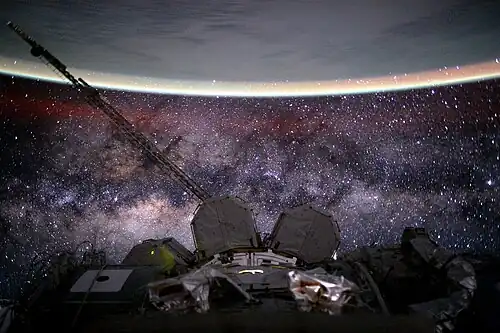 Image 63View from International Space Station, showing the yellow-green airglow of Earth's ionosphere with the Milky Way in the background. (from Outer space)