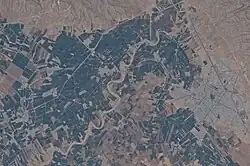 Aerial photo of the modern town of Firuzabad and the ancient circular city of Gor nearby