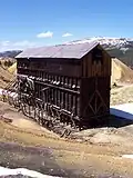 Inside-out framing has the studs on the outside and is typically used for material storage structures like this ore-bin at a mine.