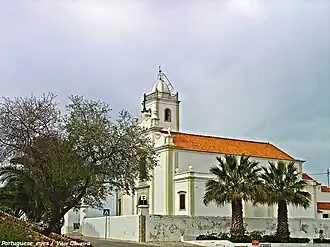 The village entrance with the Parish Church