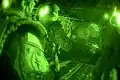 Special Forces Soldiers with the Illinois National Guard's Company A, 2nd Battalion, 20th Special Forces Group (Airborne) in Chicago, prepare for a night high altitude high opening jump at 14,000 feet from a CH-47D Chinook with Company B, 2nd Battalion, 238th Aviation Regiment in Peoria, Illinois, at Fort McCoy, Wisconsin, August 8.